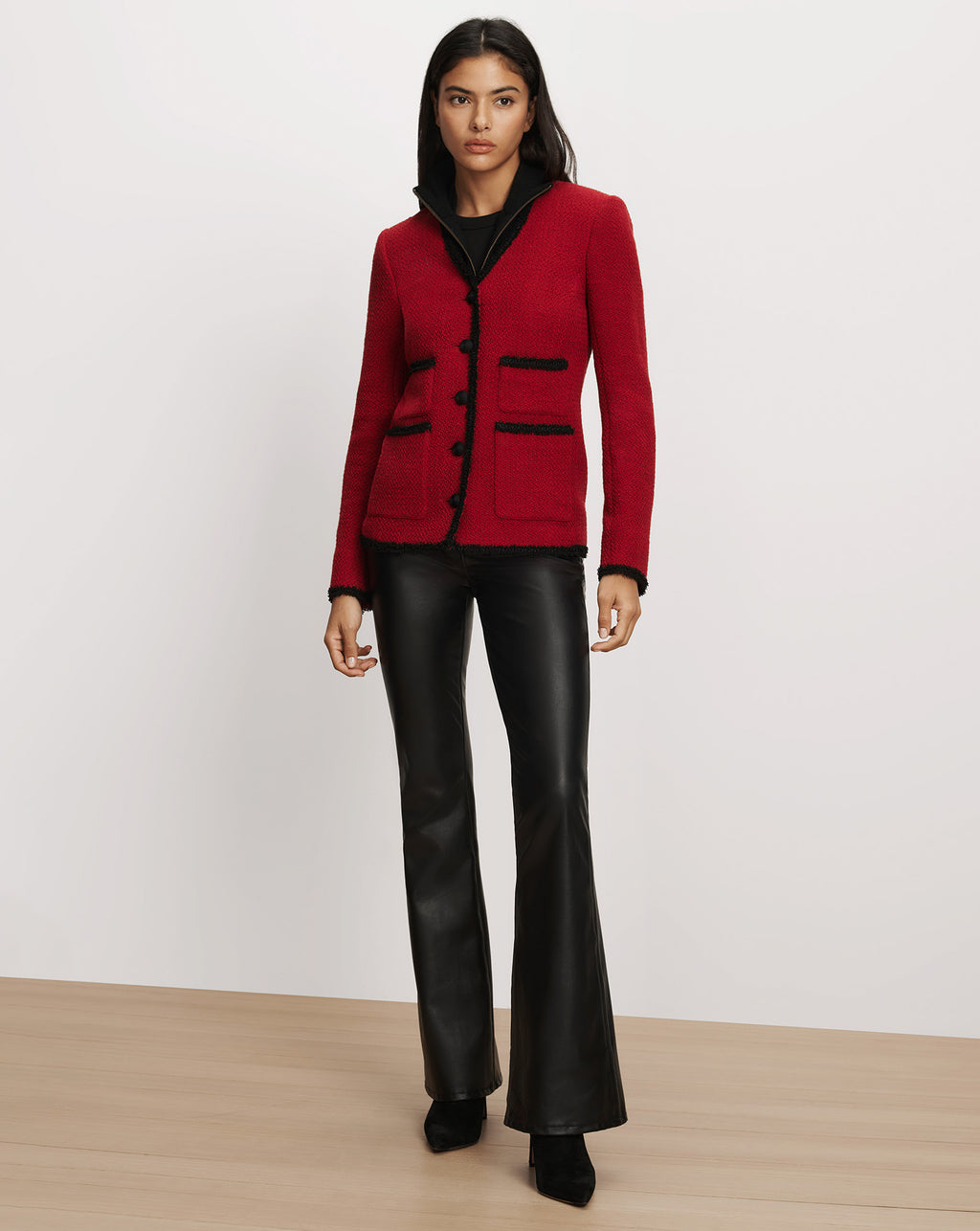 Veronica Beard Red tweed jacket with black trim details.
