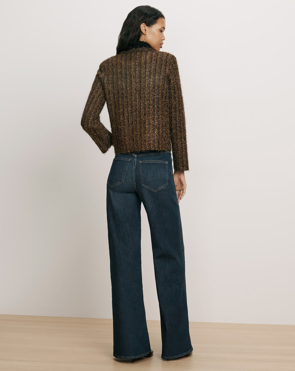 Veronica Beard Brown tweed jacket and blue denim jeans.
