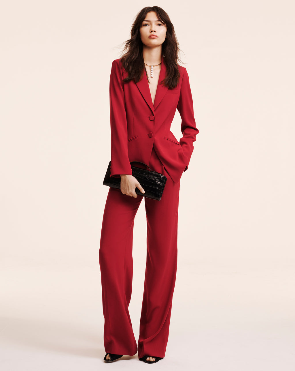 Veronica Beard Red pantsuit with blazer and matching trousers.