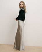 Veronica Beard Black embroidered sweater and grey silk maxi skirt.