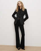 Veronica Beard Black floral jacquard blazer and flared trousers.