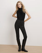 Veronica Beard Black sleeveless turtleneck sweater and floral trousers.