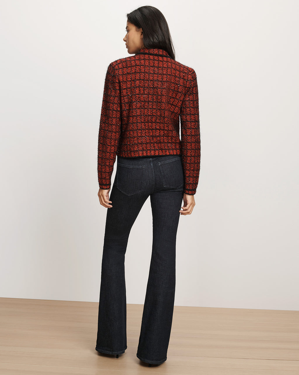 Veronica Beard Red tweed blazer and dark denim flare jeans.