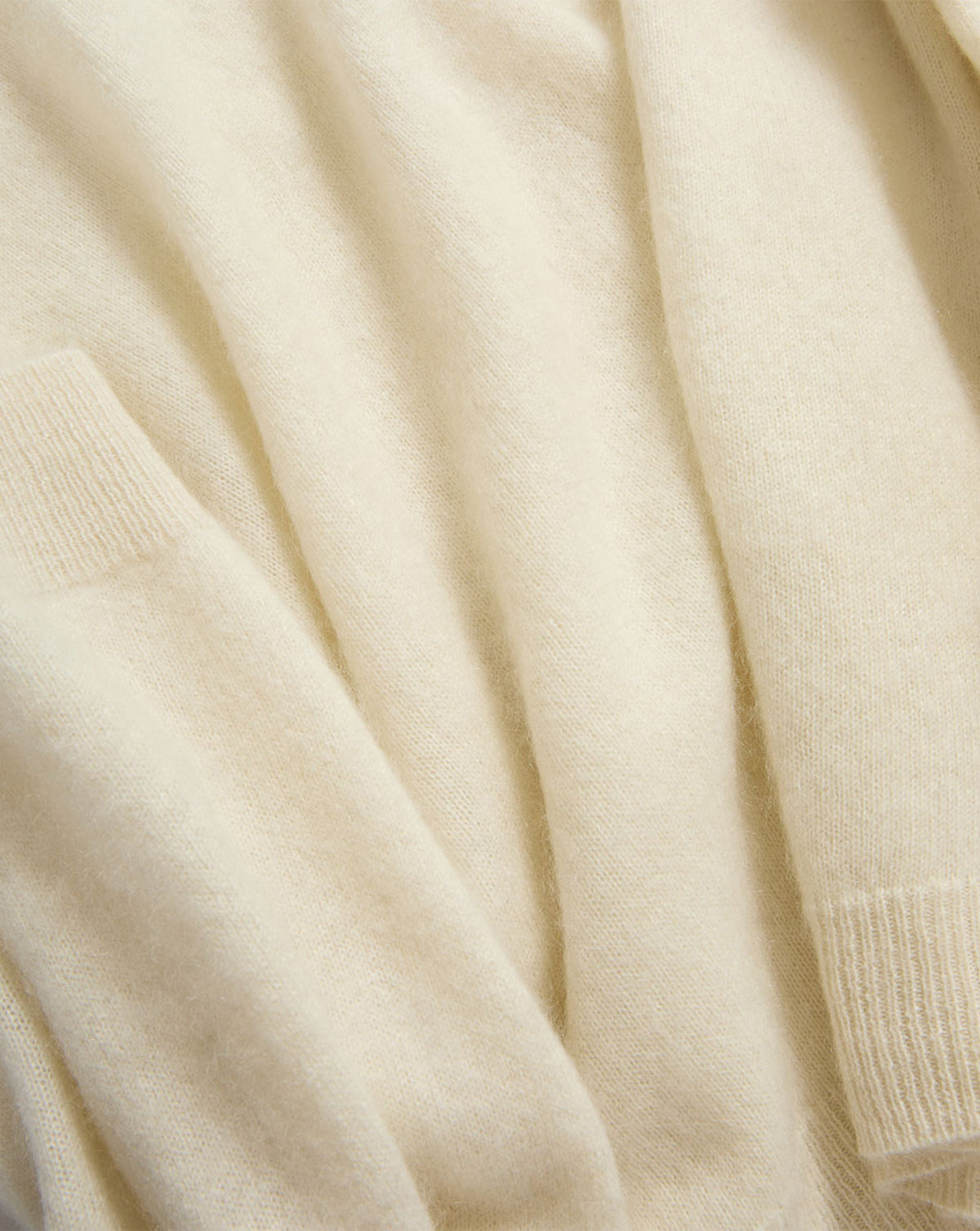 Veronica Beard Soft cream cashmere sweater with ribbed cuffs.