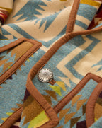 Veronica Beard Blue patterned wool jacket with brown trim.