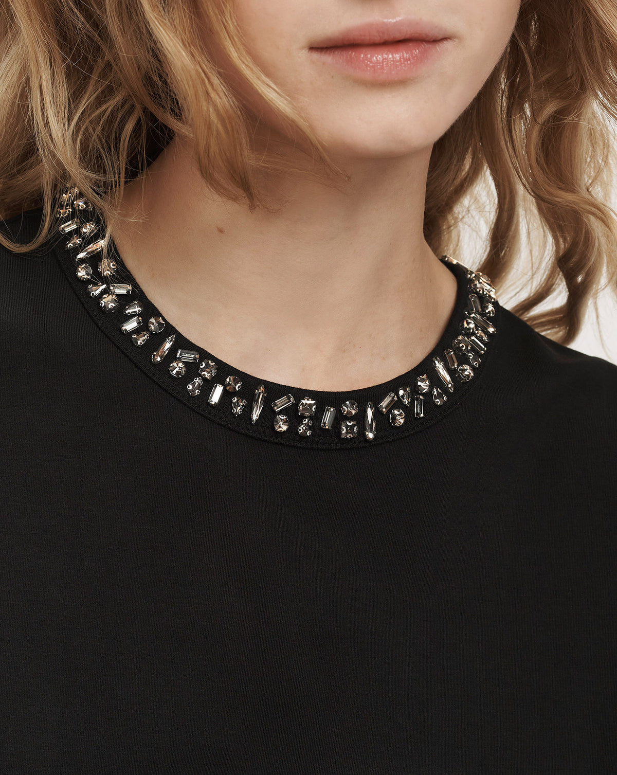 Veronica Beard Black crewneck top with crystal embellished neckline.