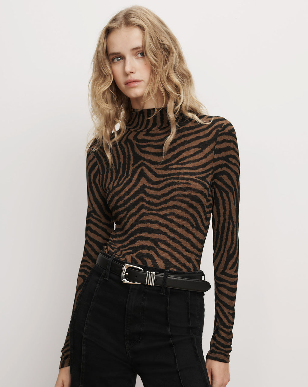 Veronica Beard Brown zebra print fitted turtleneck top.