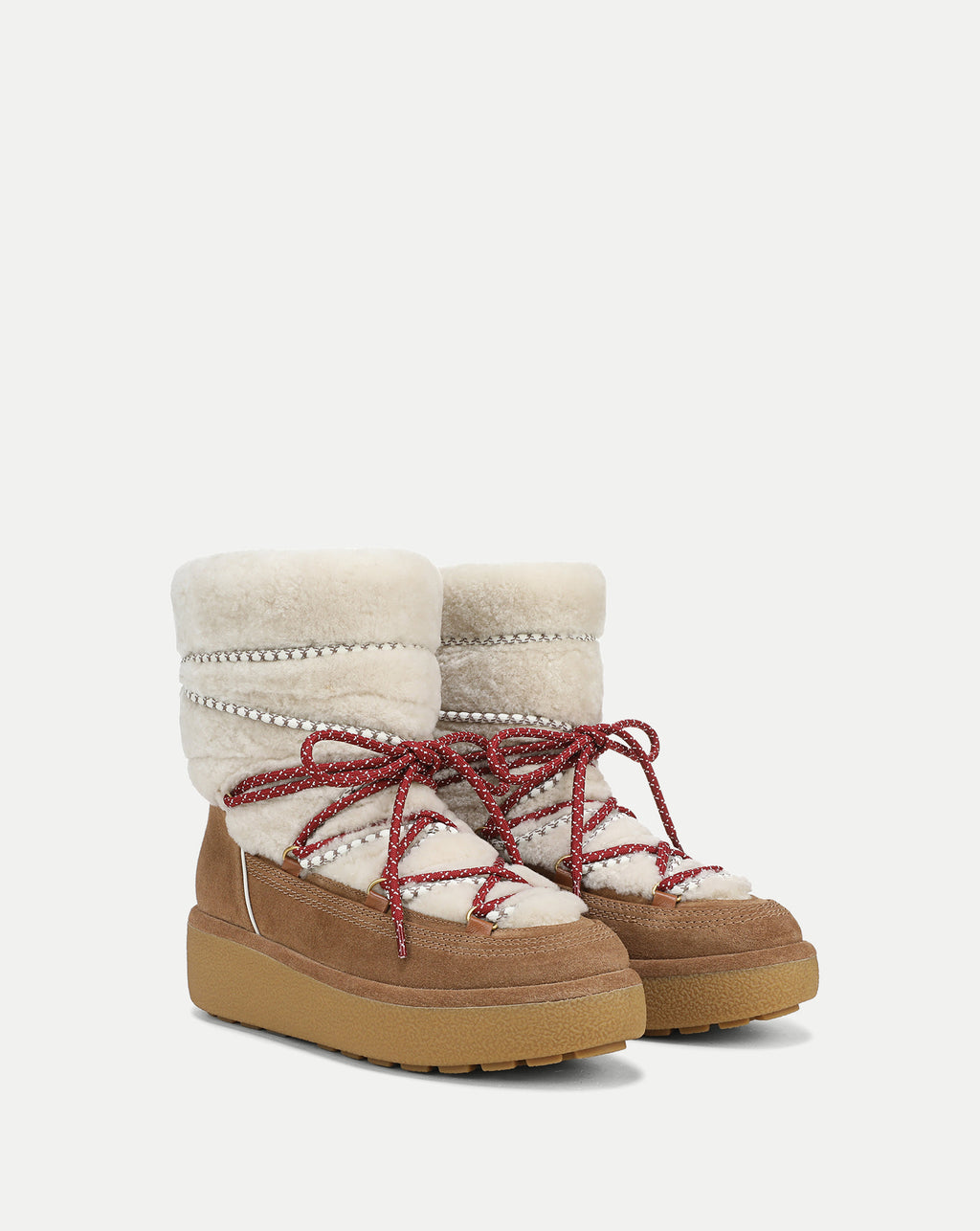 Veronica Beard Tan and white shearling platform snow boots.