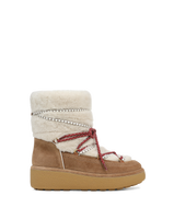 Veronica Beard Brown suede shearling boot with red laces.