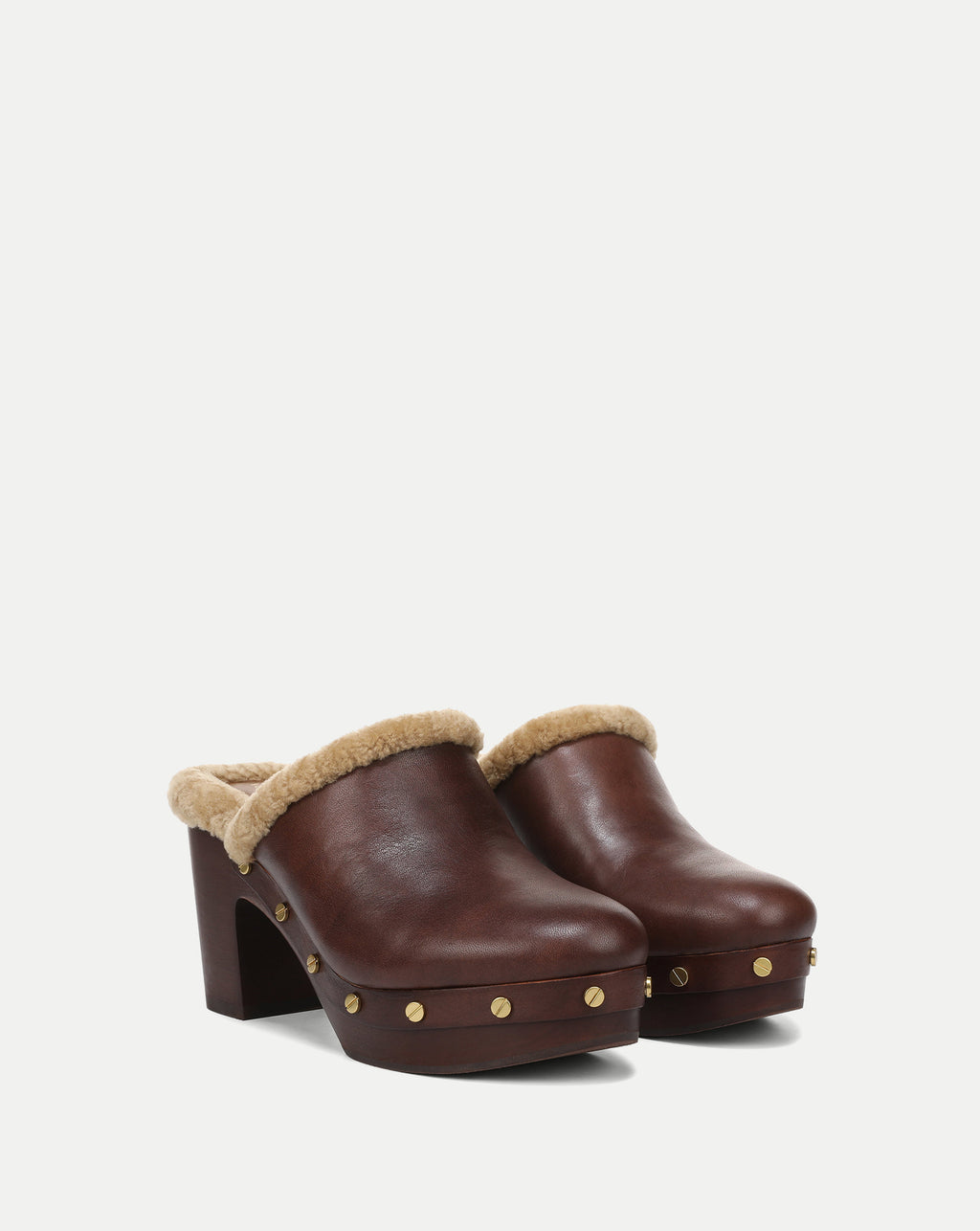 Veronica Beard Brown leather clogs with shearling trim.
