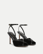 Veronica Beard Black patent leather and velvet heeled sandals.