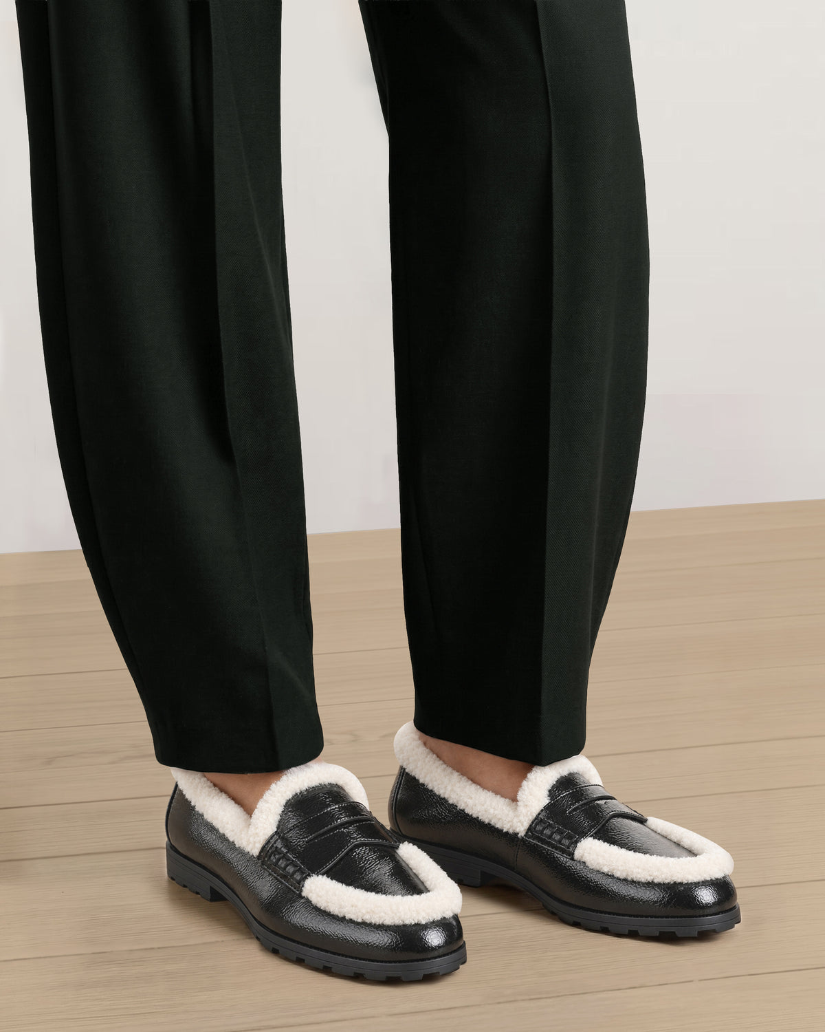Veronica Beard Black leather shearling-trim loafers with lug soles.