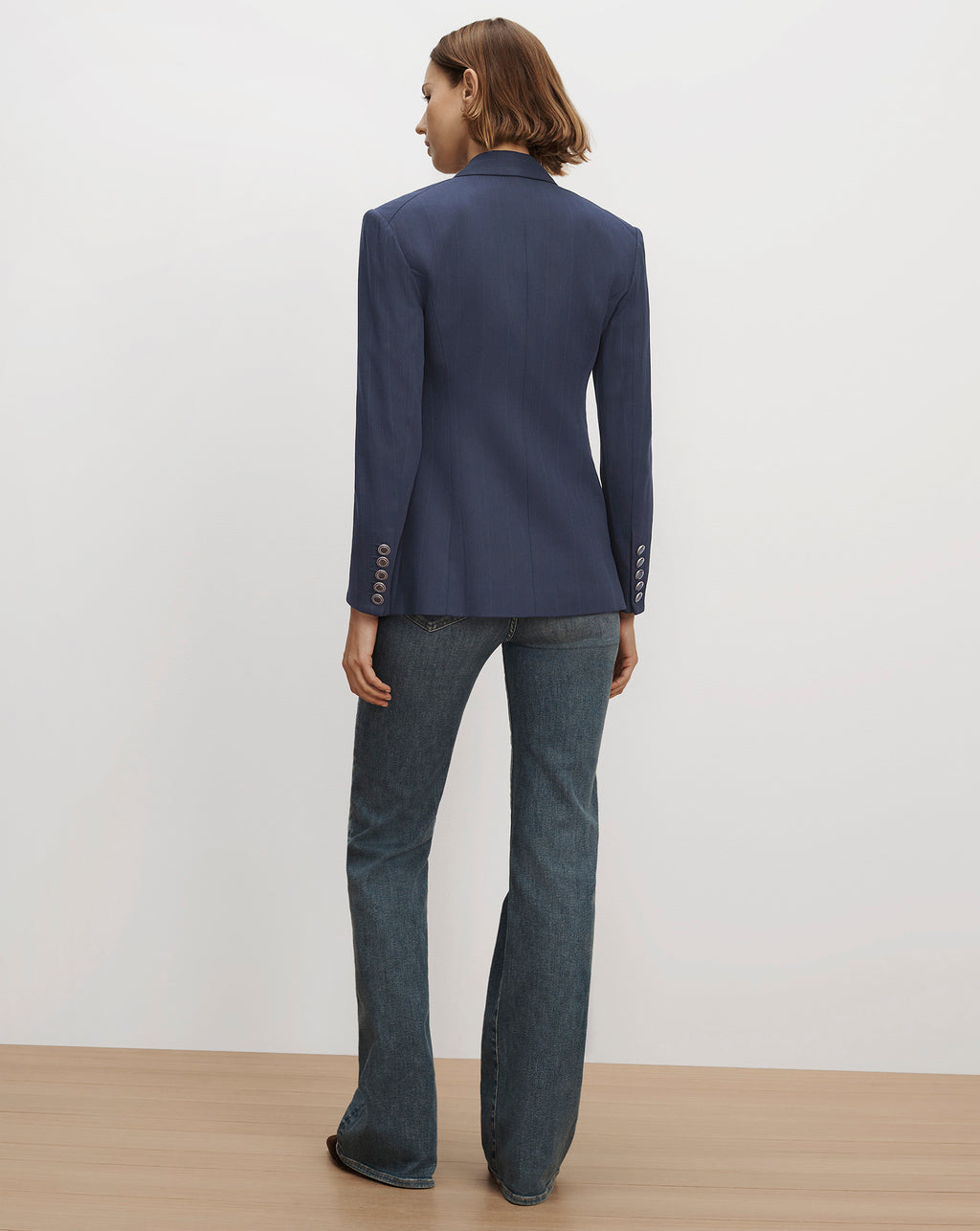 Veronica Beard Blue fitted blazer and denim jeans.