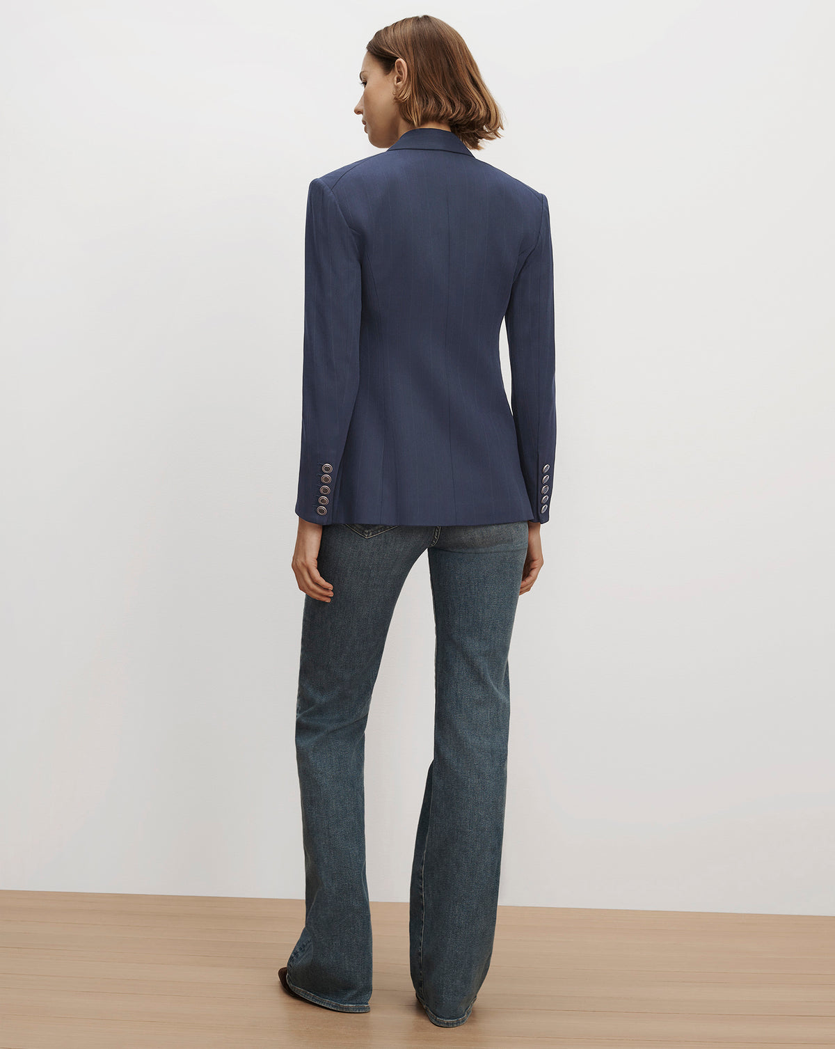 Veronica Beard Blue fitted blazer and denim jeans.