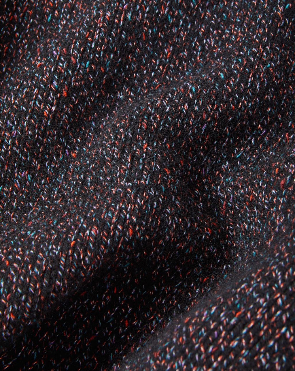 Veronica Beard Black speckled knit fabric with colorful flecks.