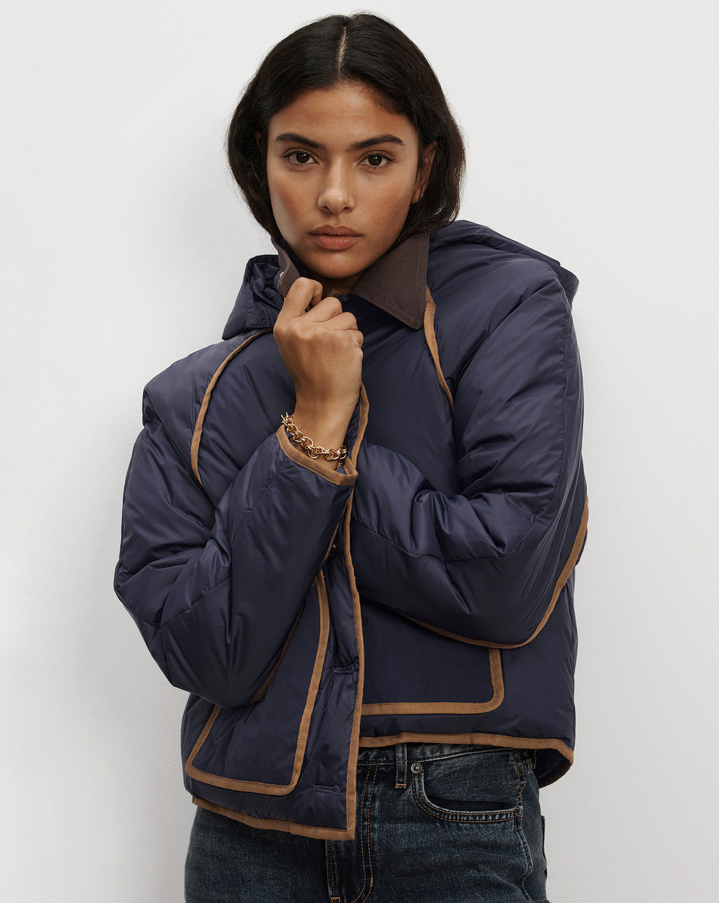 Veronica Beard Navy blue quilted puffer jacket with brown trim.