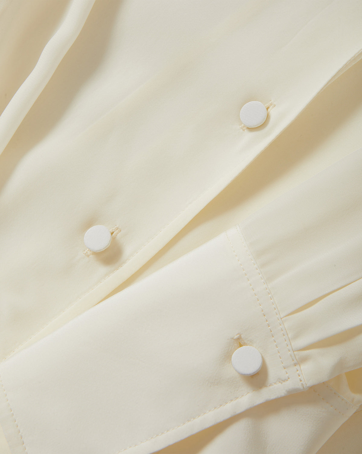 Veronica Beard Beige silk blouse with fabric-covered buttons.