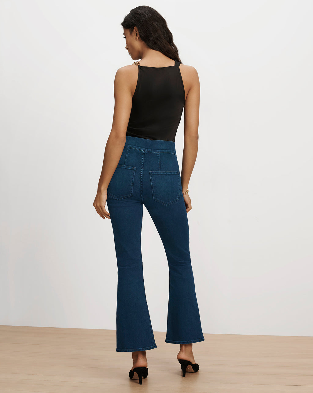 Veronica Beard Blue denim flared jeans and black tank top.