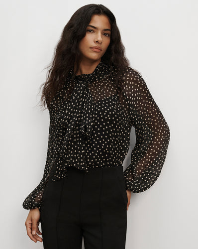 Veronica Beard Sheer black polka dot tie-neck blouse.