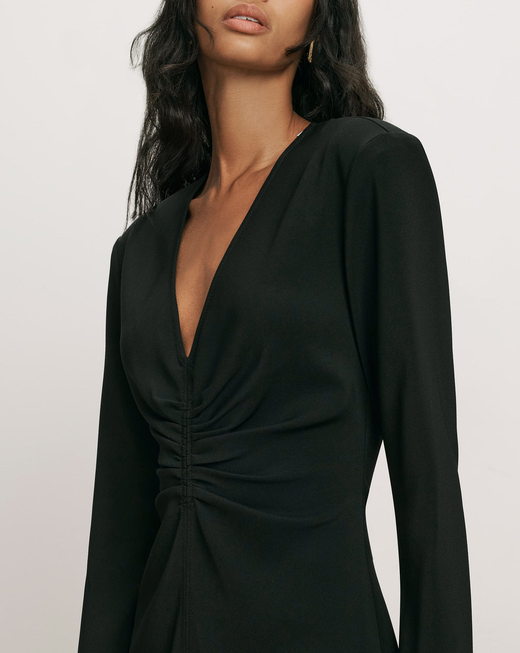 Veronica Beard Black long-sleeve dress with plunged ruched bodice.