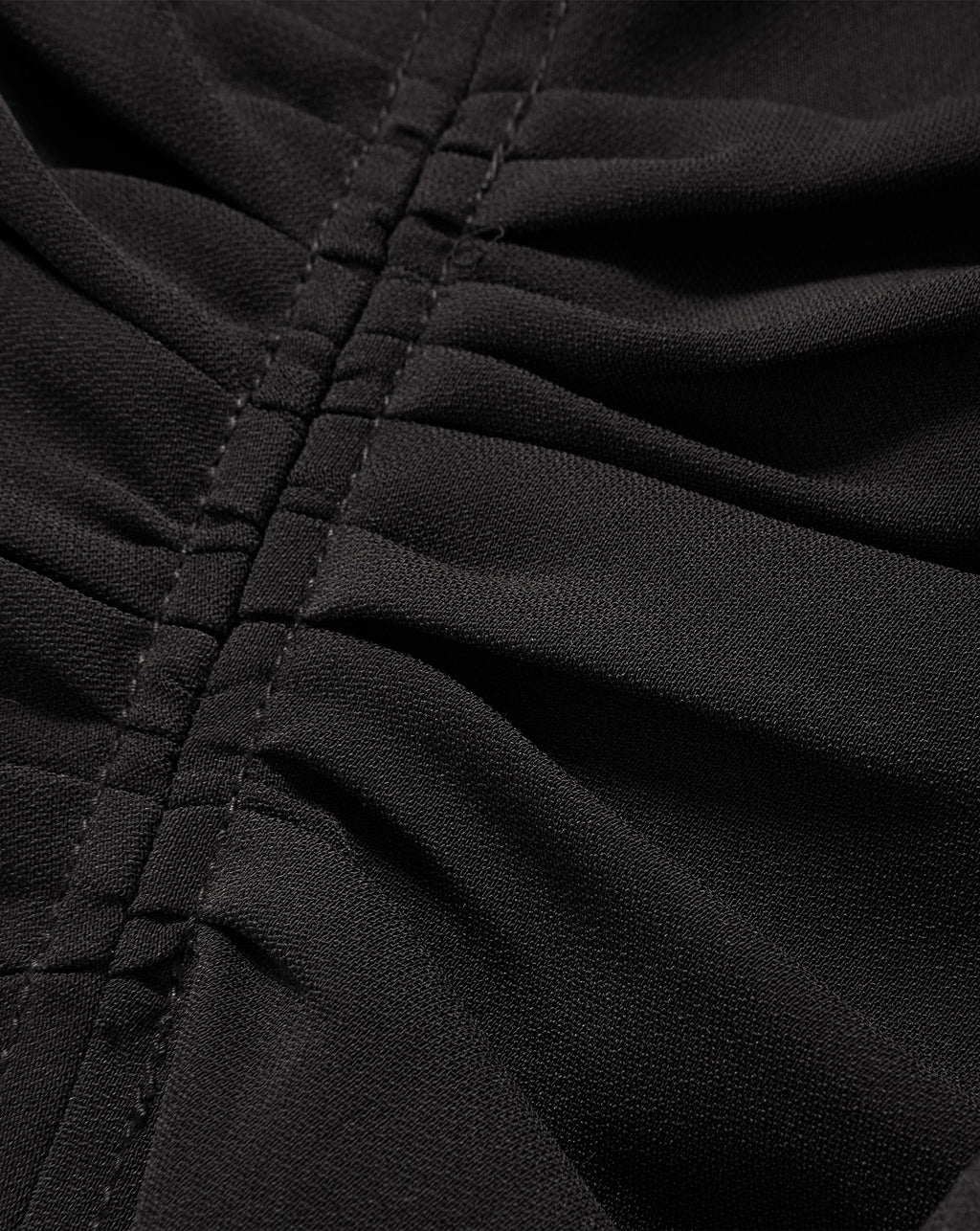 Veronica Beard Black ruched fabric with central gathered seam.