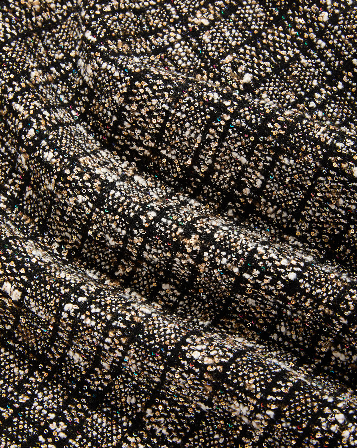 Veronica Beard Black textured tweed fabric with metallic and sequined details.
