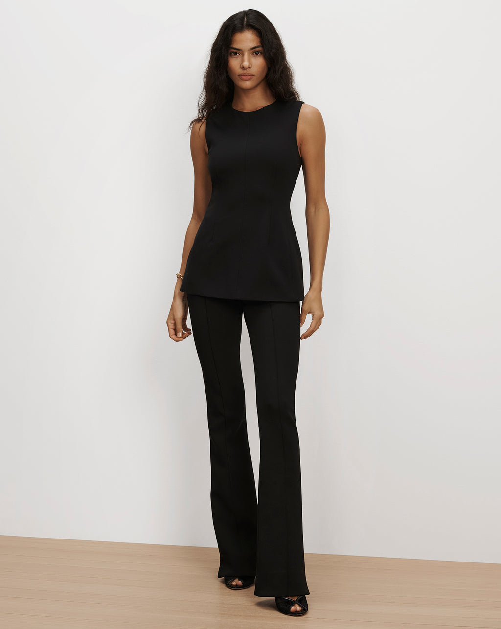 Veronica Beard Black sleeveless top and flared trousers.