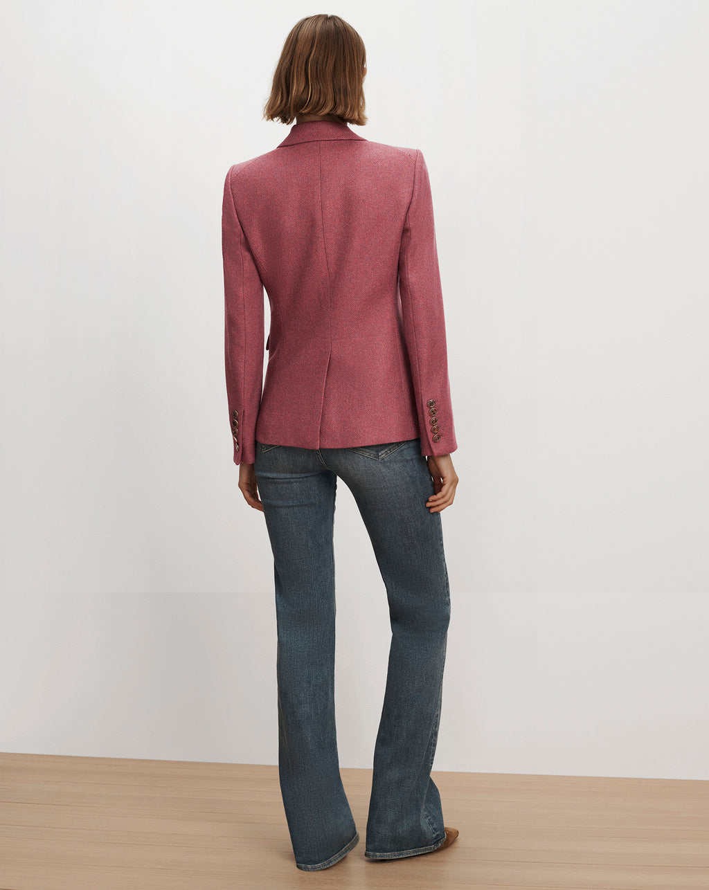 Veronica Beard Pink wool blazer and blue denim jeans.