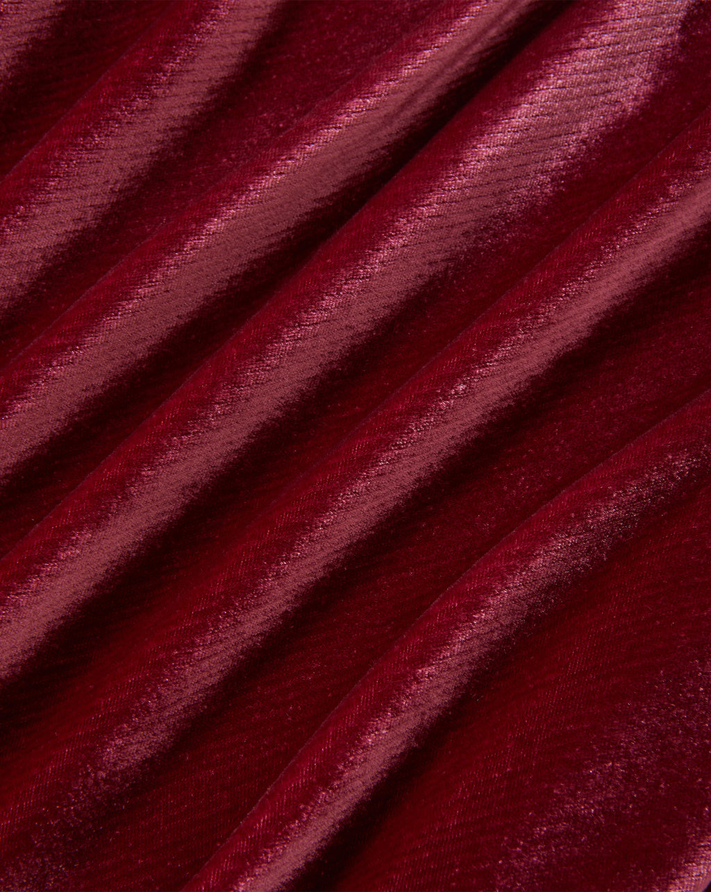 Veronica Beard Burgundy velvet fabric with diagonal folds and soft texture.