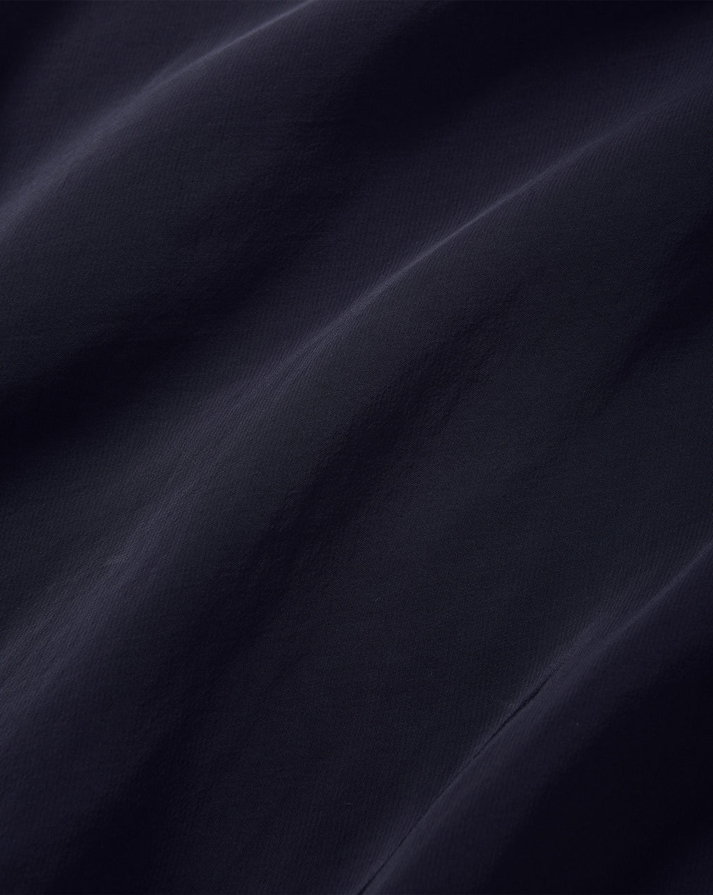 Veronica Beard Dark blue smooth woven silk fabric texture.