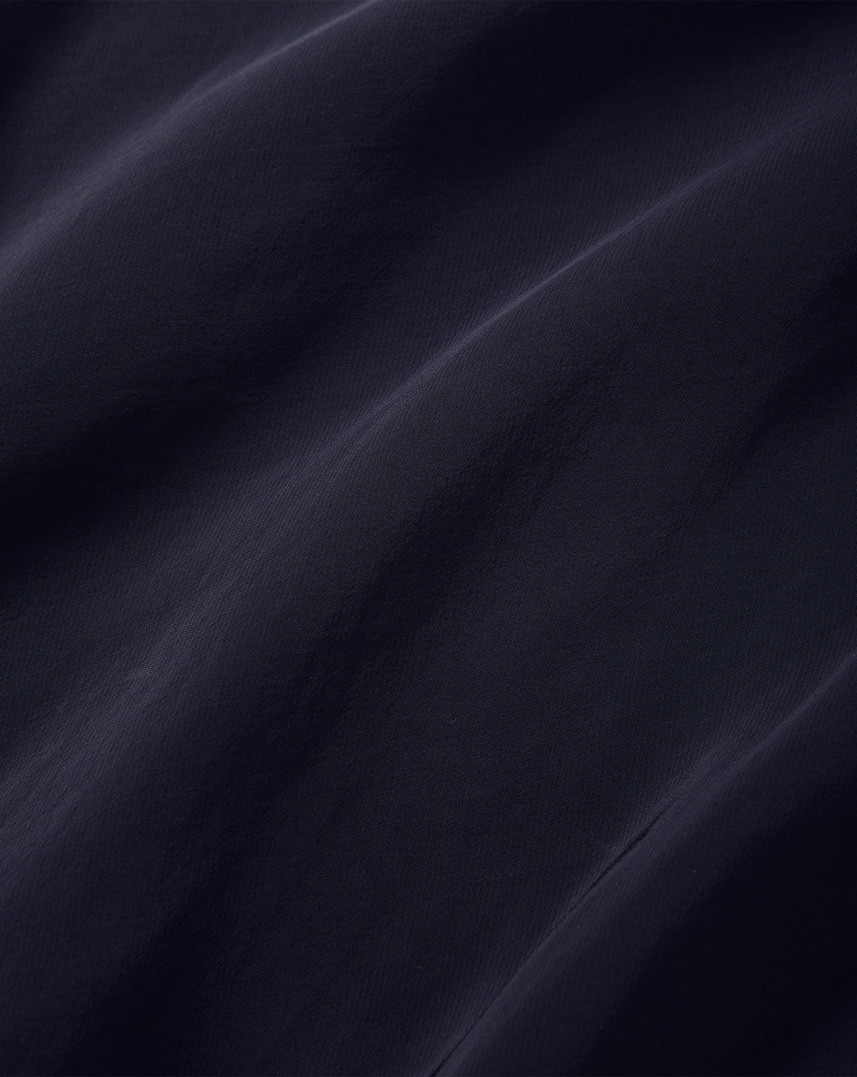 Veronica Beard Dark blue smooth woven silk fabric texture.
