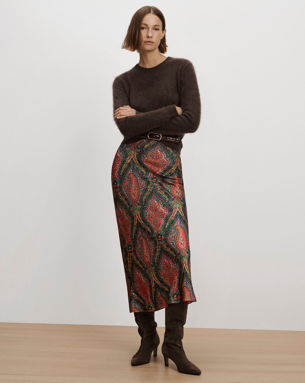Veronica Beard Brown knit sweater and colorful patterned skirt.