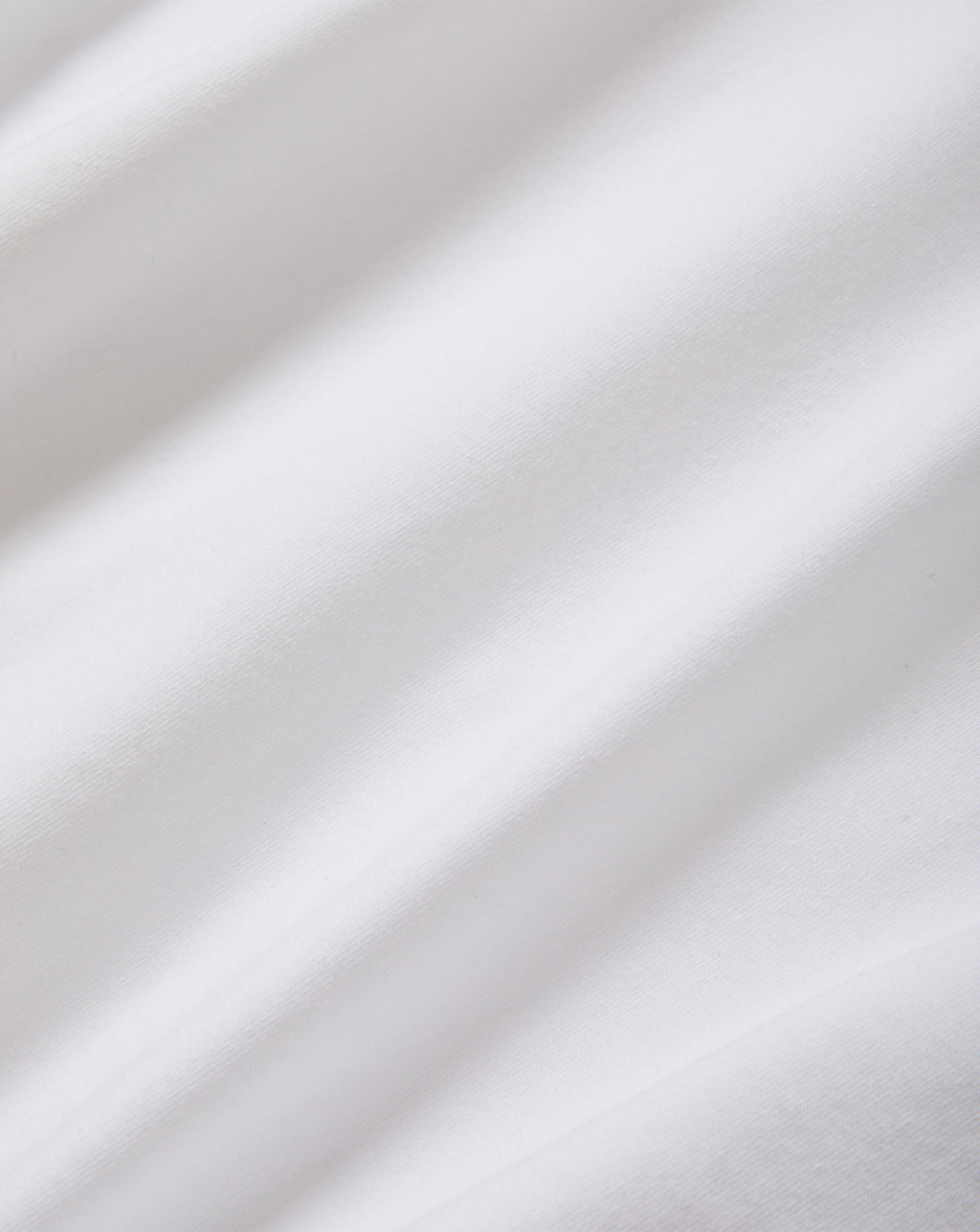 Veronica Beard White cotton fabric with soft diagonal folds.