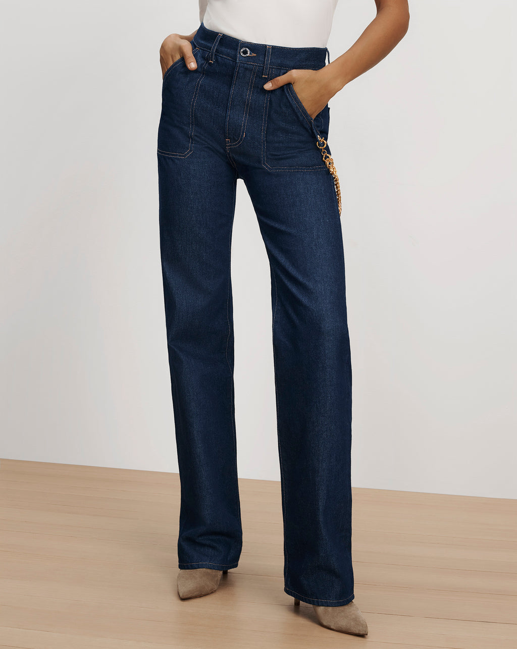 Veronica Beard Dark blue denim straight-leg jeans with chain detail.