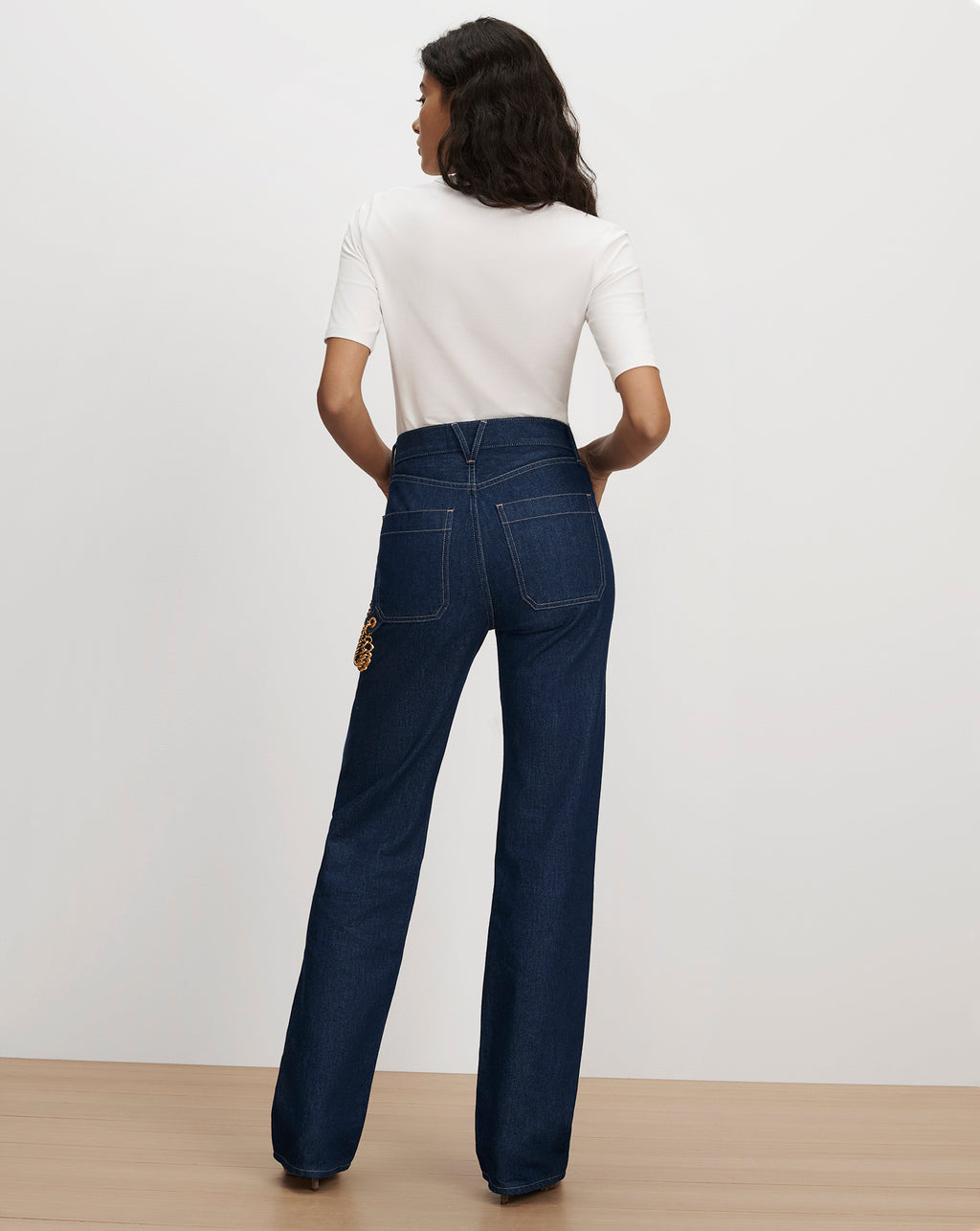 Veronica Beard White t-shirt and dark blue denim jeans.