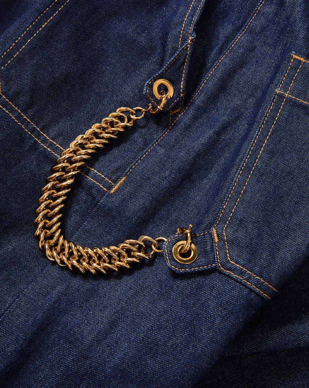 Veronica Beard Blue denim dress with gold chain detail.
