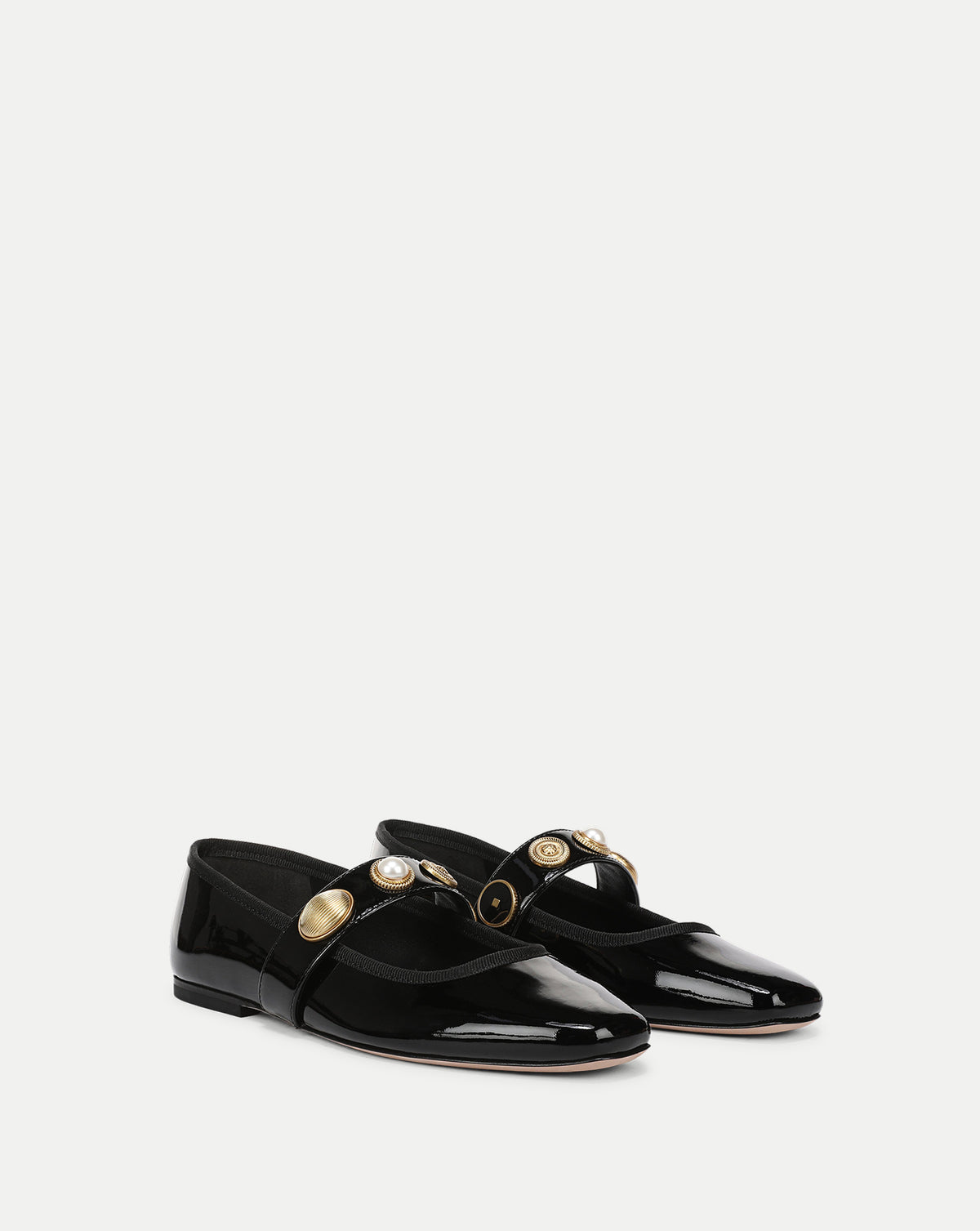 Veronica Beard Black patent leather flats with gold buttons.