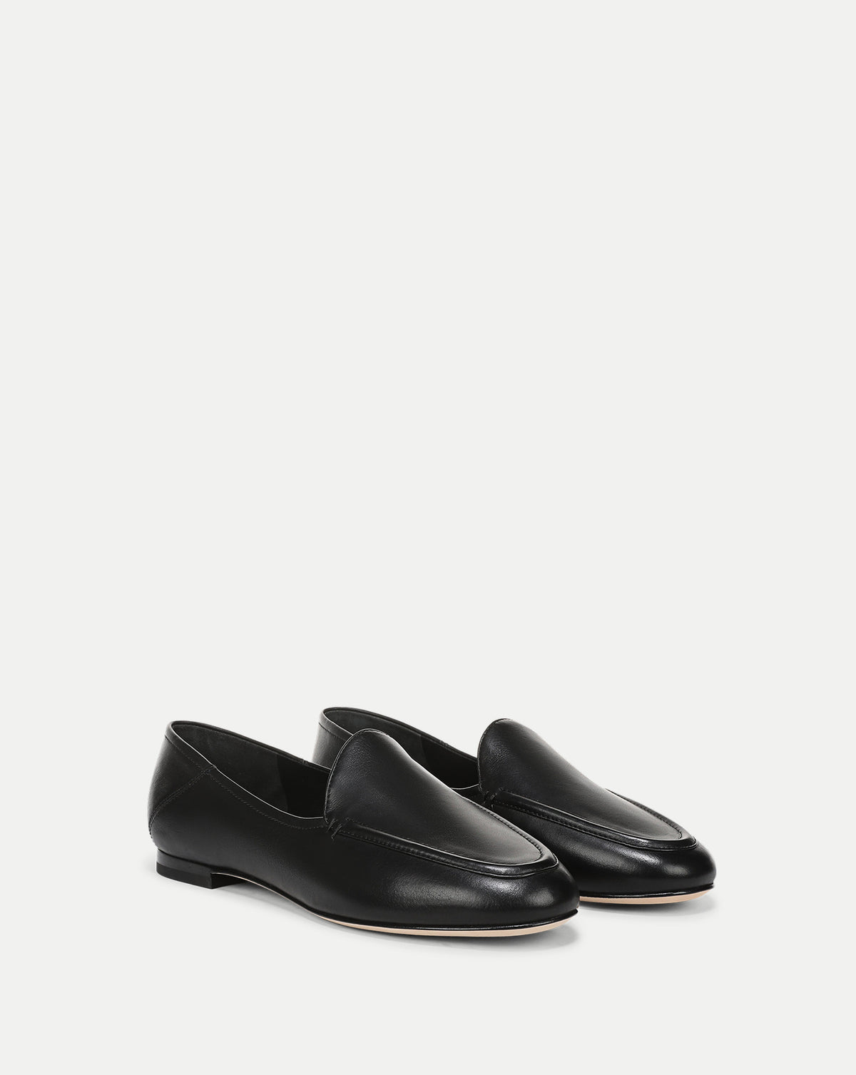 Veronica Beard Black leather slip-on loafers with almond toes.