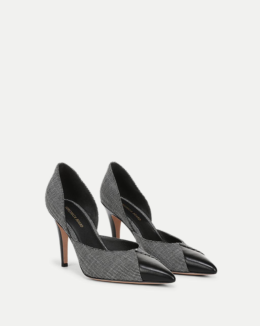 Veronica Beard Black and white tweed pointed-toe stiletto pumps.