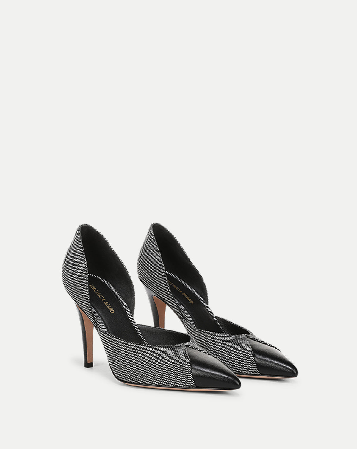 Veronica Beard Black and white tweed pointed-toe stiletto pumps.