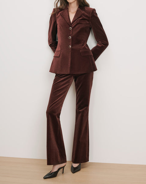 Veronica Beard Burgundy velvet tailored blazer and flared trousers set.