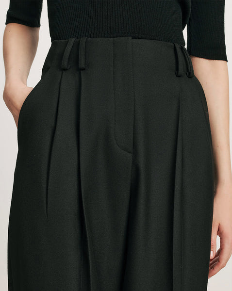 Veronica Beard Black pleated high-waisted wide-leg trousers.