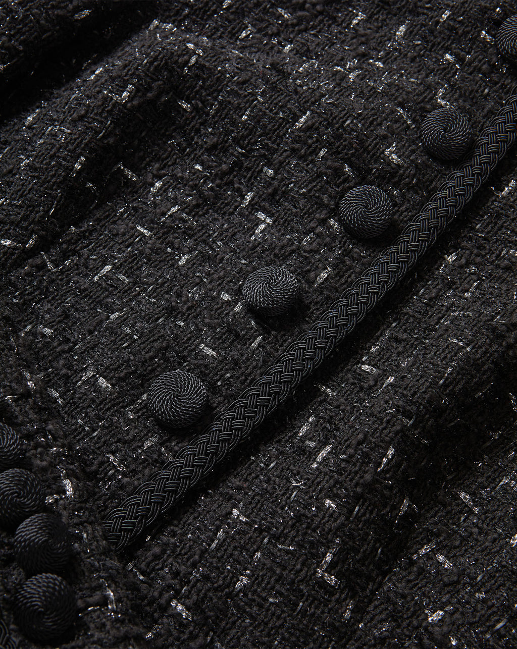 Veronica Beard Black tweed jacket with braided trim and buttons.