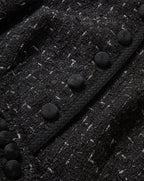 Veronica Beard Black tweed jacket with braided trim and buttons.
