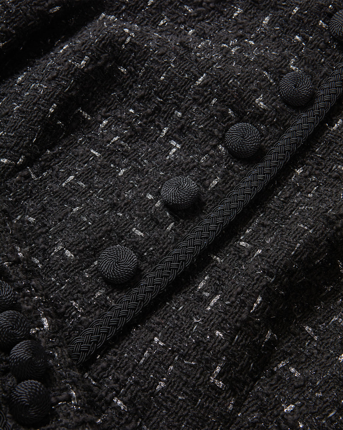 Veronica Beard Black tweed jacket with braided trim and buttons.