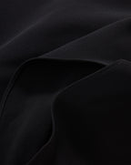 Veronica Beard Black textured fabric garment with stitched seams.