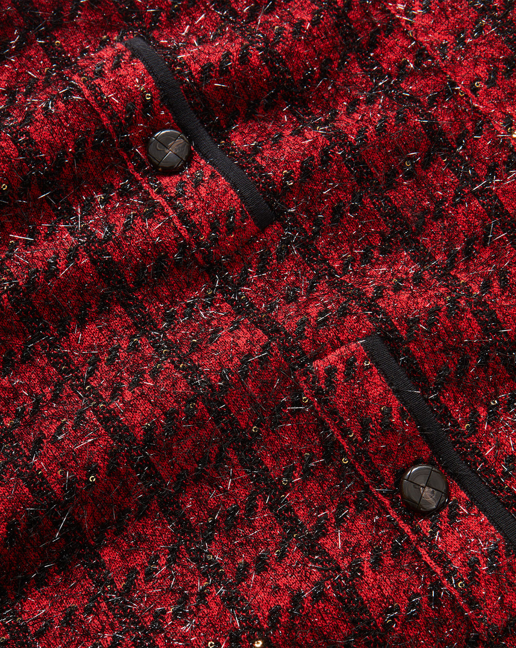 Veronica Beard Red textured tweed jacket with black trim.