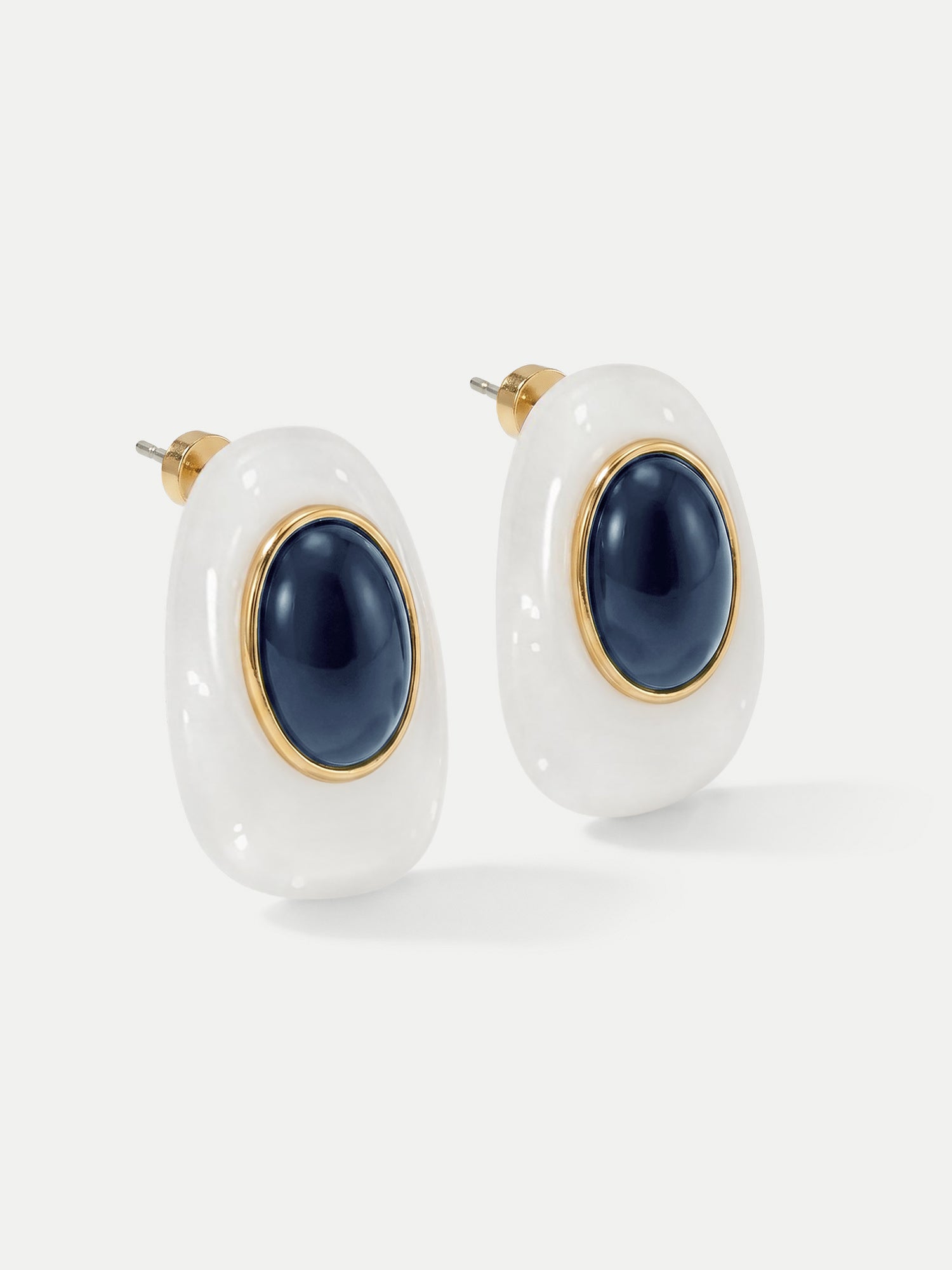 Veronica Beard White and navy resin earrings with gold-tone accents.