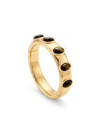 Veronica Beard Gold hinged bangle with dark oval stones.