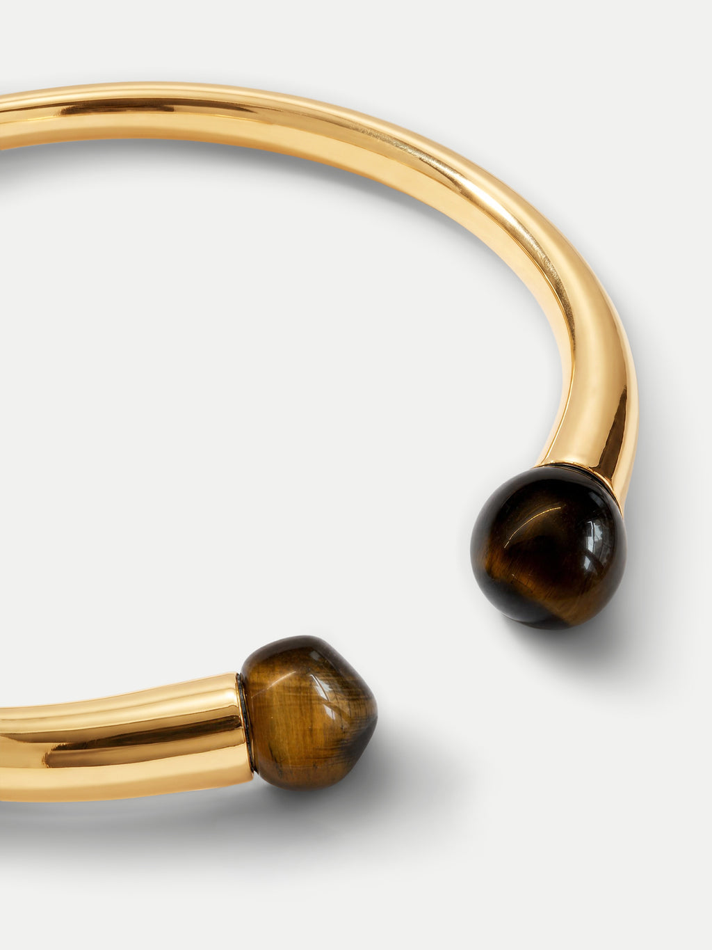 Veronica Beard Gold cuff bracelet with brown tiger eye beads.